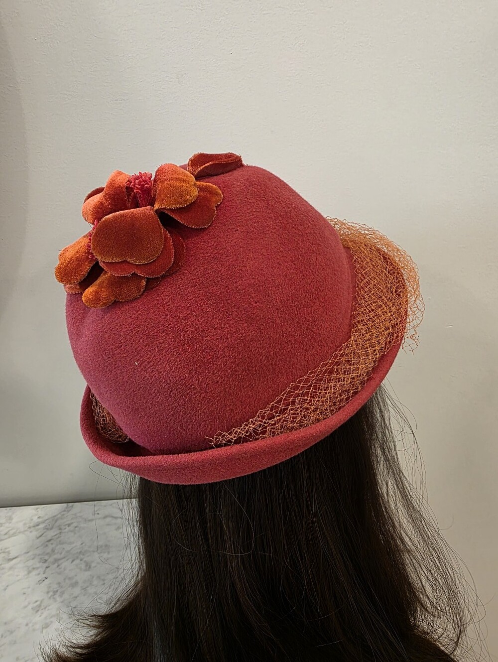 Lola Hats Cosmopolitan Red Felt Cloche Hat with Orange Flower Detail